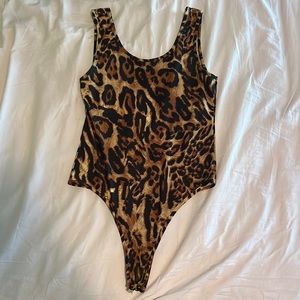 Ellie and Kate, cheetah print body suit with clips at bottom, super stretchy